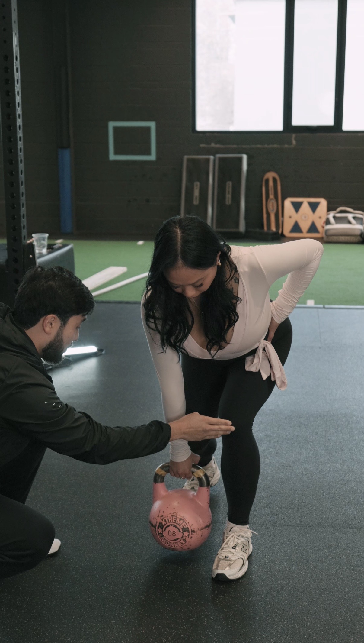 Sam Park coaching a client during an in-person 1-on-1 personal training session